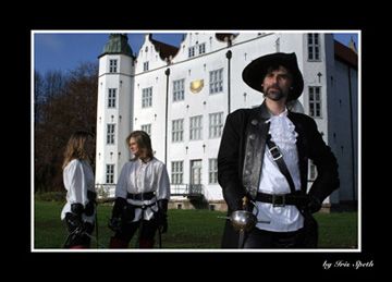 Three musketeers in front of Ahrensburg Castle
